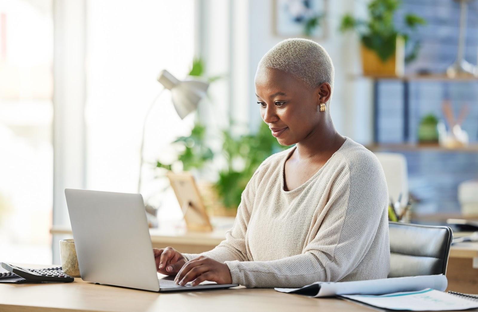 woman working on her computer at a desk
