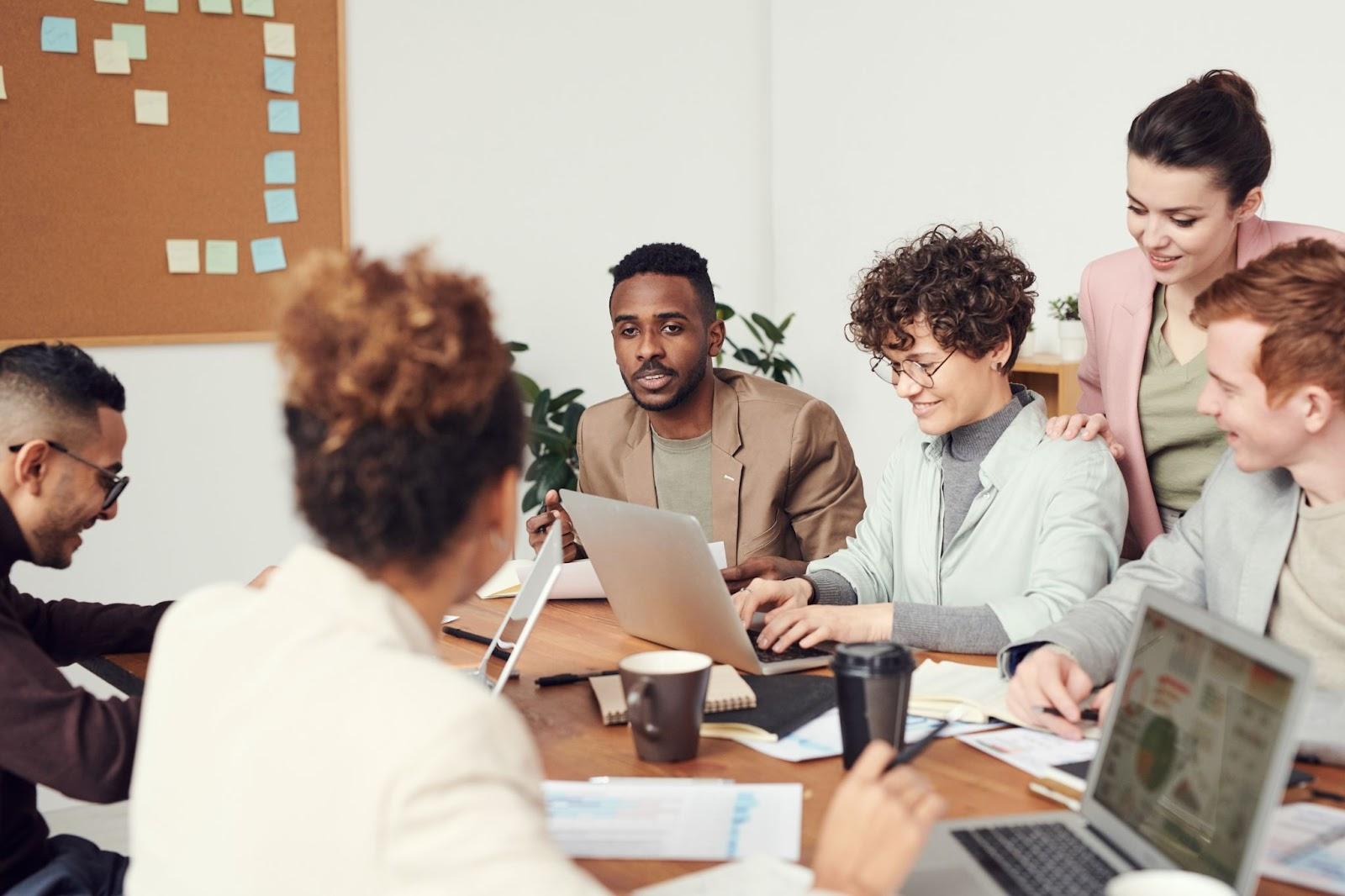 team members working together around a computer